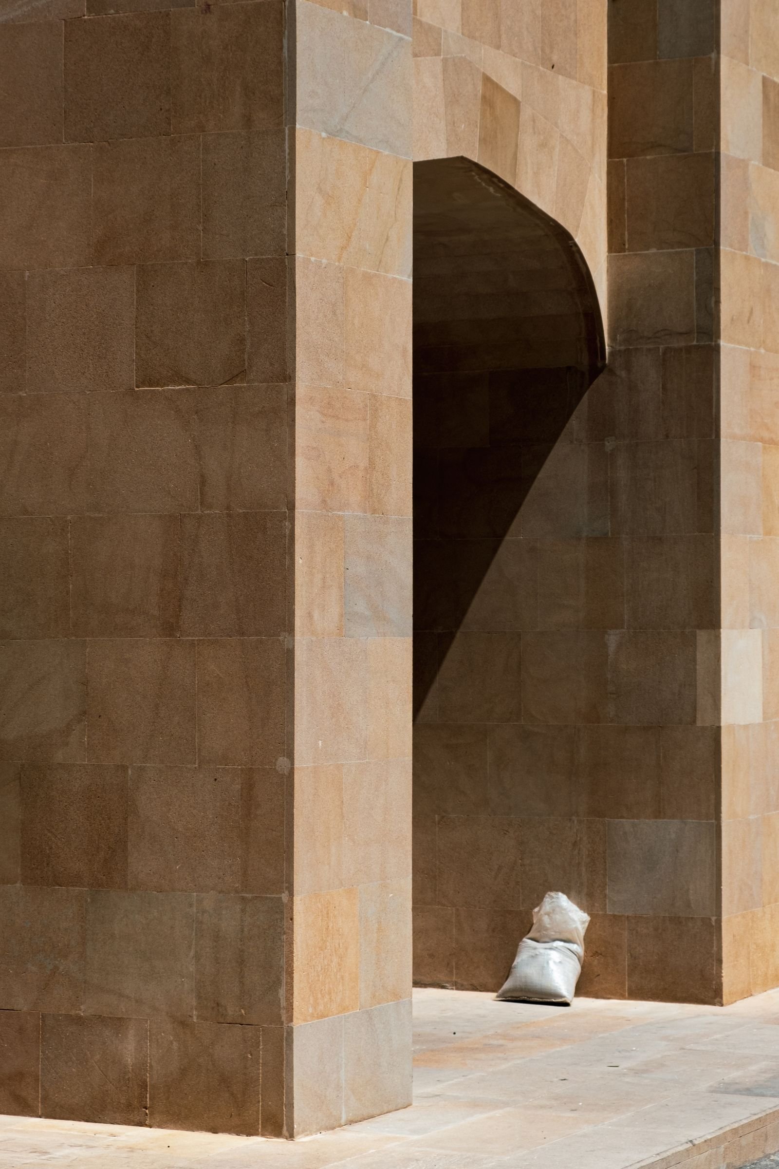 Sunlit architectural stone archway and pale flooring for Middle Eastern design inspiration; not an exact RJ-TR installation