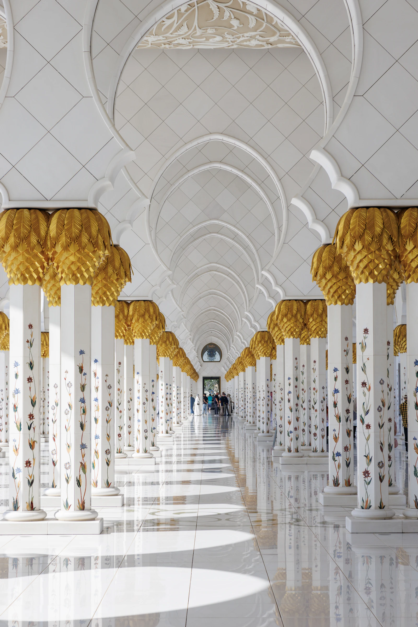 Grand Islamic-inspired arches and reflective marble-look flooring as architectural inspiration