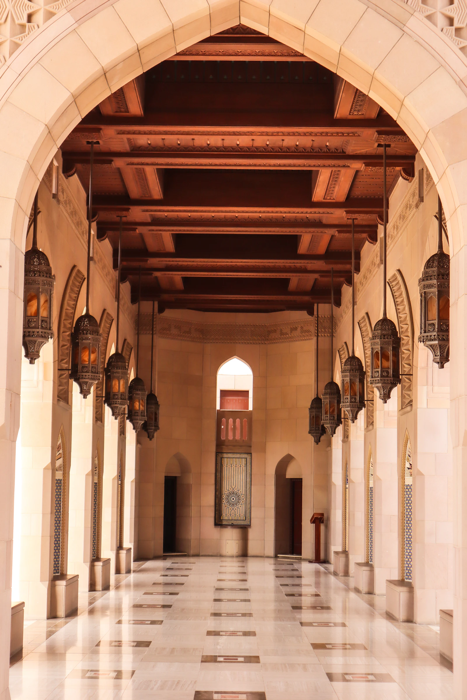 Arched corridor with stone look flooring