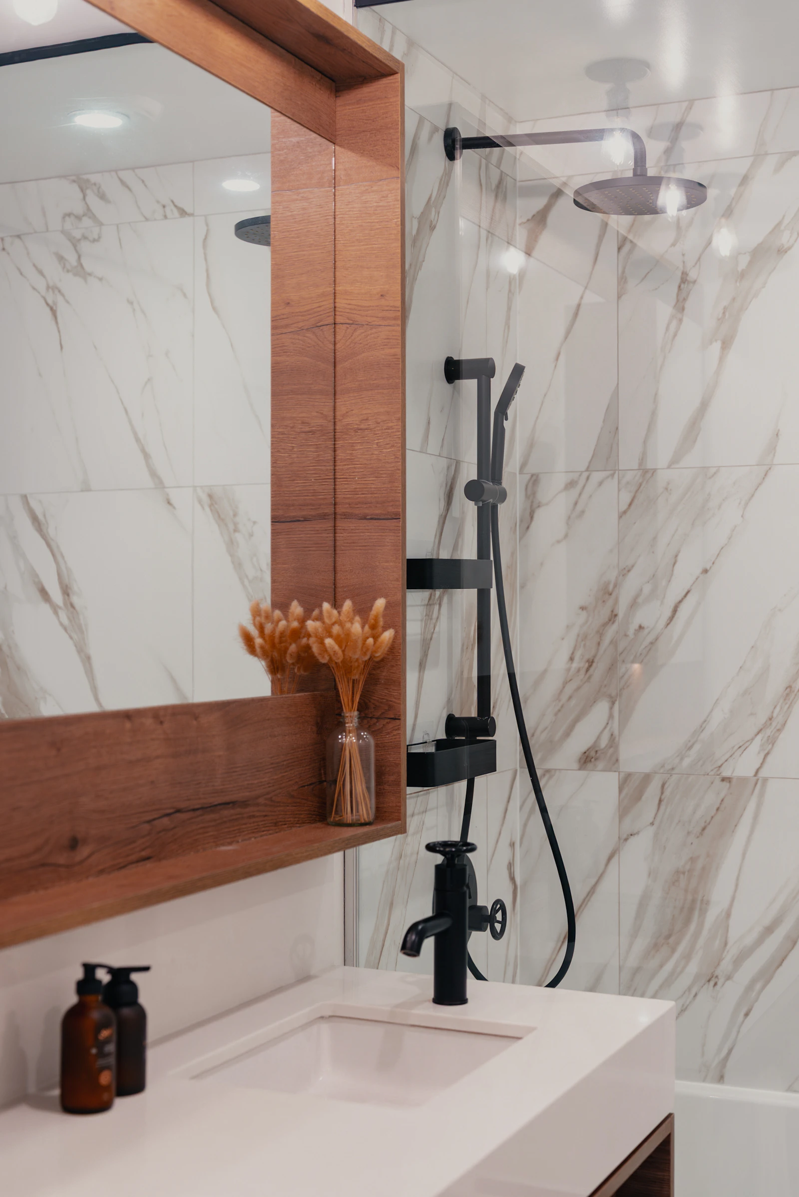 Marble-inspired feature wall within contemporary bathroom architecture
