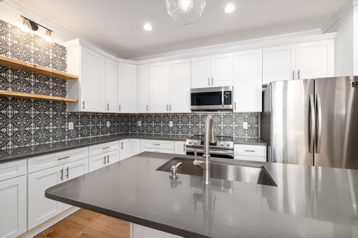 Contemporary kitchen with geometric ceramic wall tiles