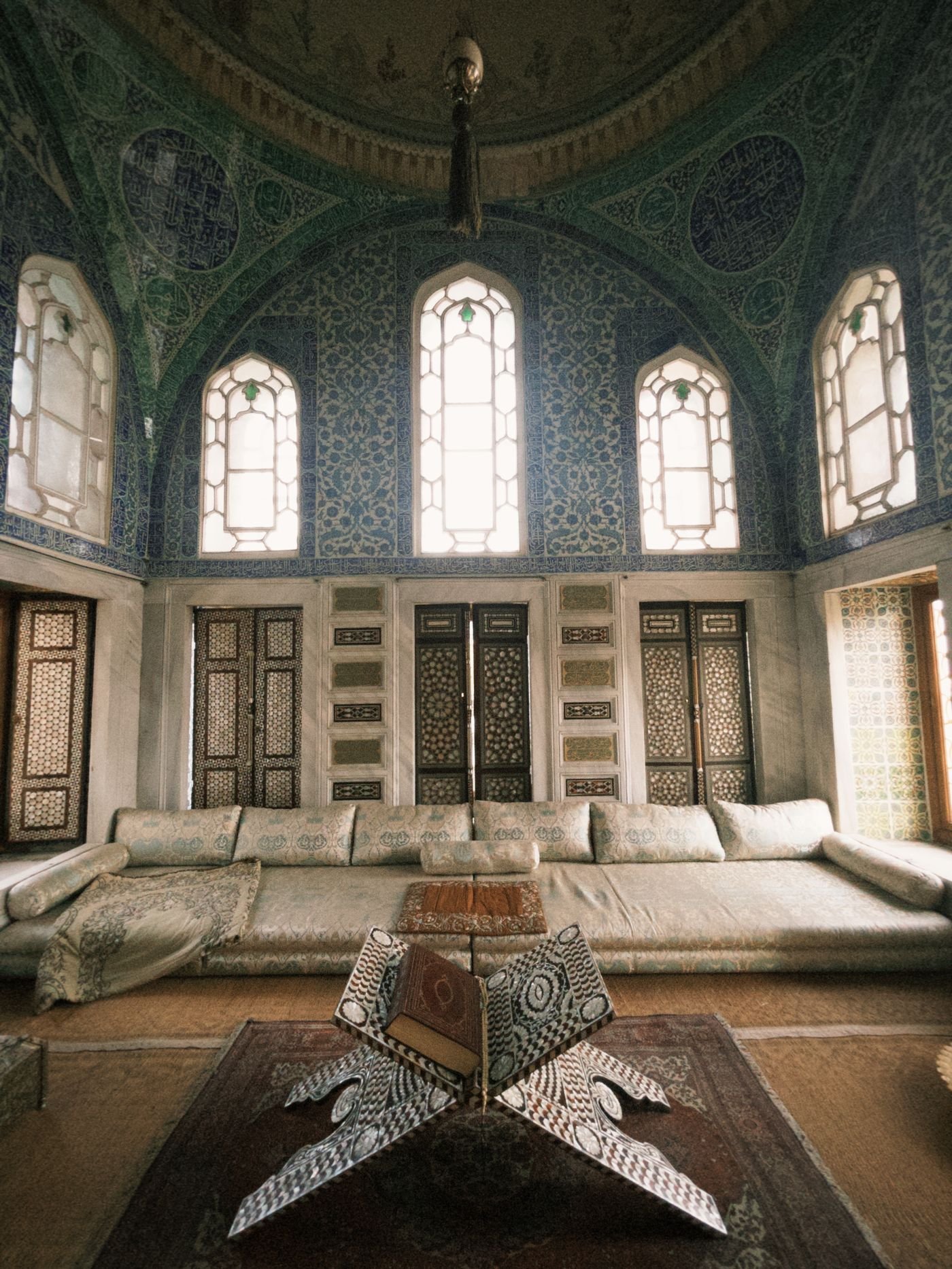 Decorative tiled architectural interior with richly patterned motifs