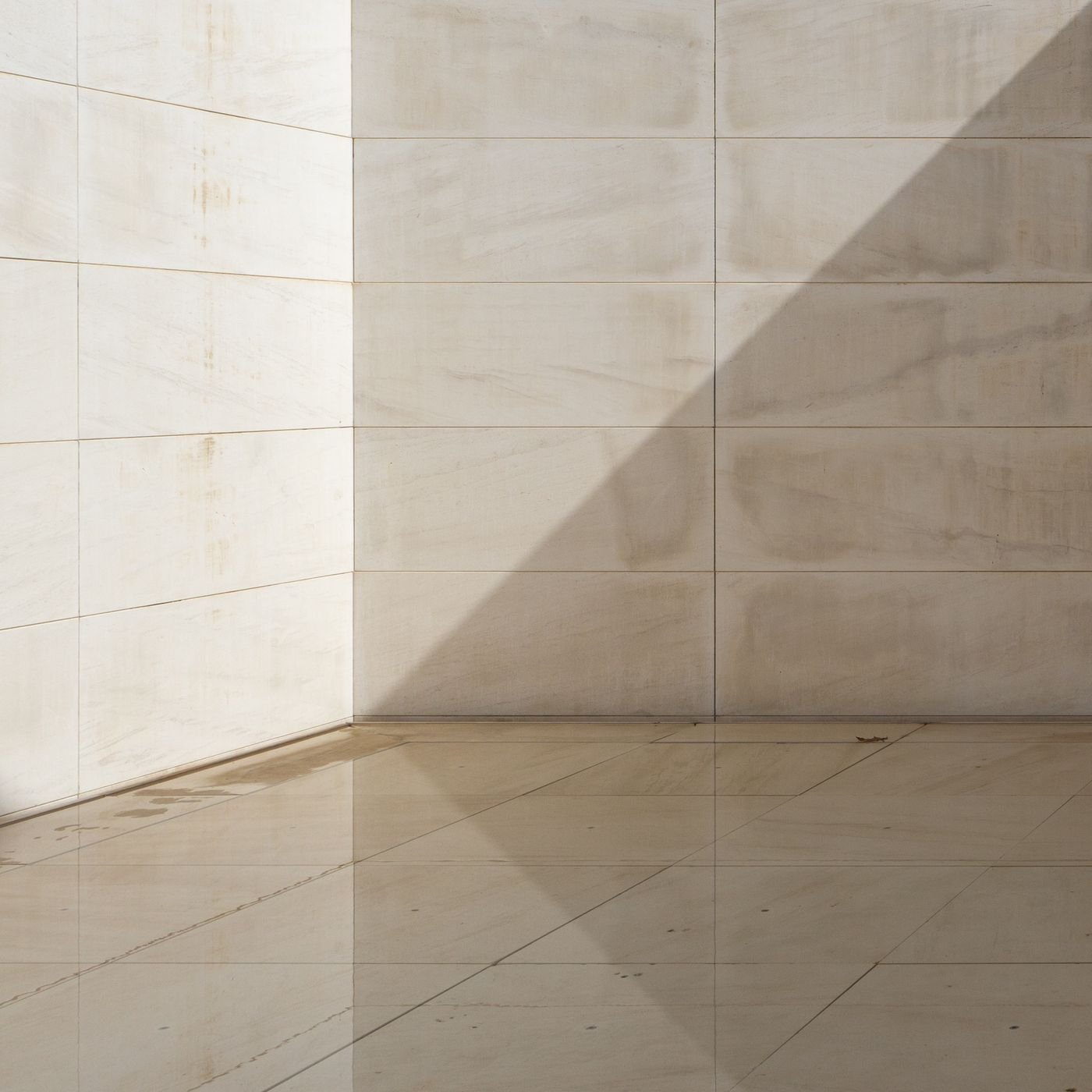 Modern stone and marble-effect tiled architectural surfaces