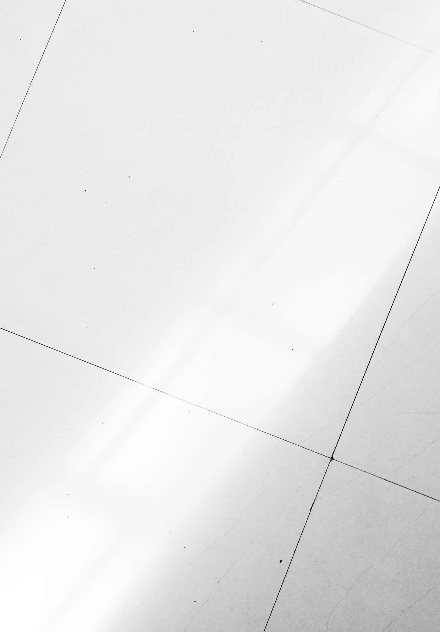 White tiled floor illuminated by natural sunlight