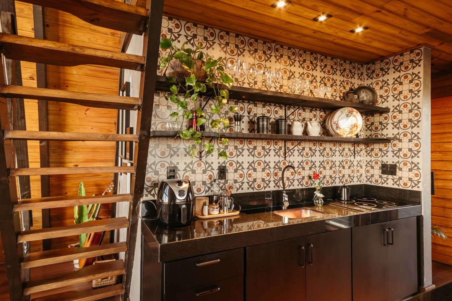 Decorative patterned tiles forming kitchen wall backsplash
