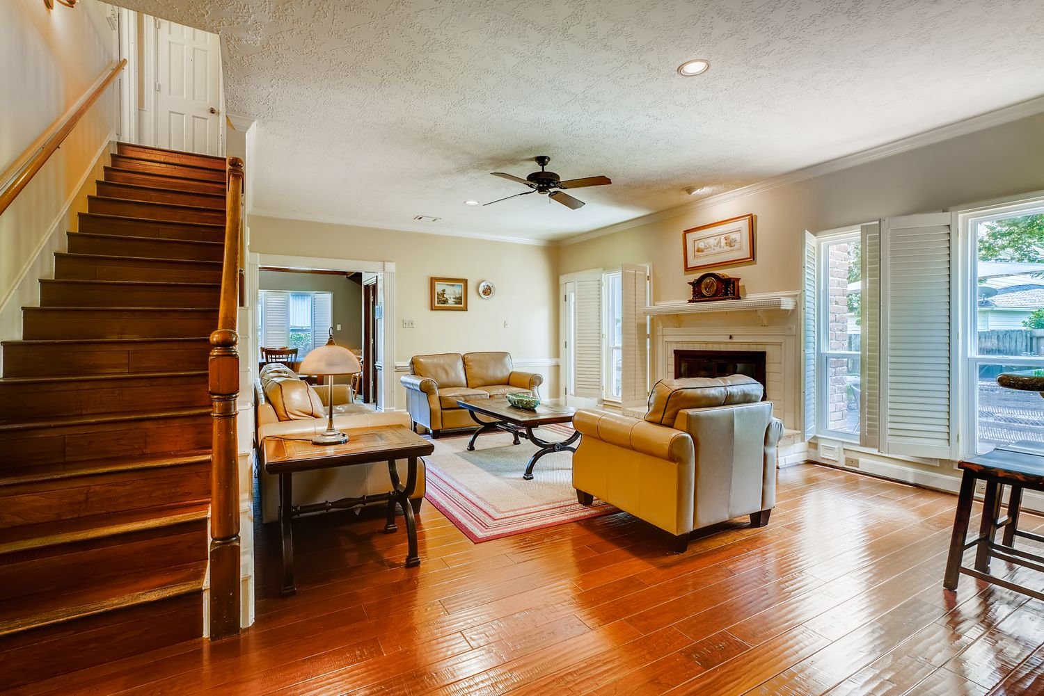 Natural wood tone floor design inspiration in a bright family room